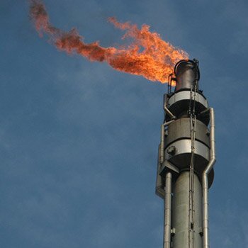 Utilization of gas flaring from oil production facilities for energy access